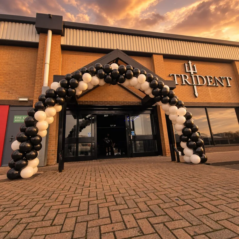 Large balloon arch installed at a business entrance